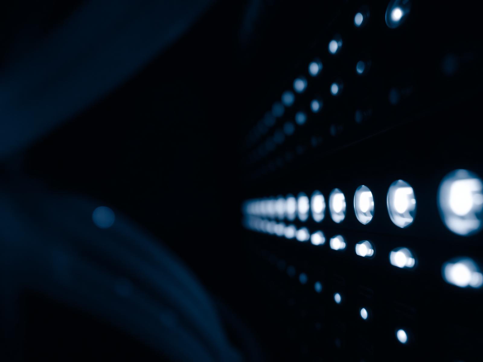 Server rack lights in a dark data centre